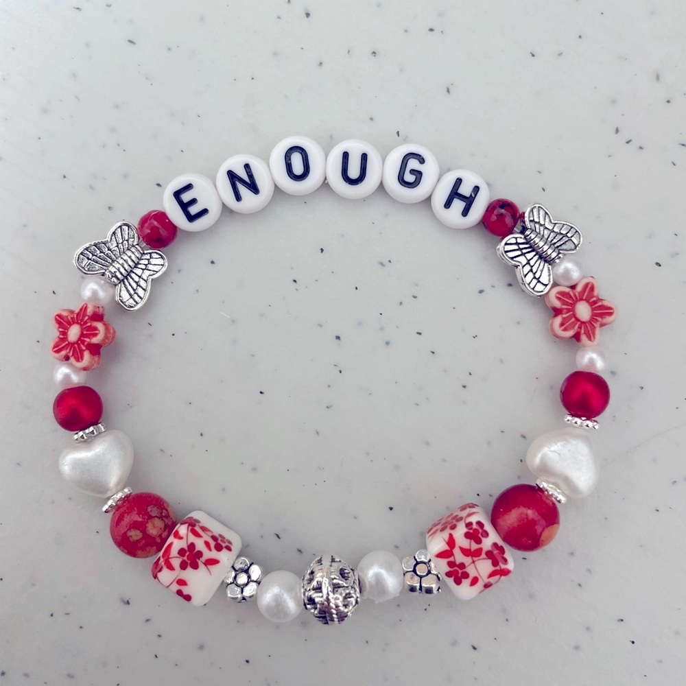 The ENOUGH braces in red and silver beautiful gift.